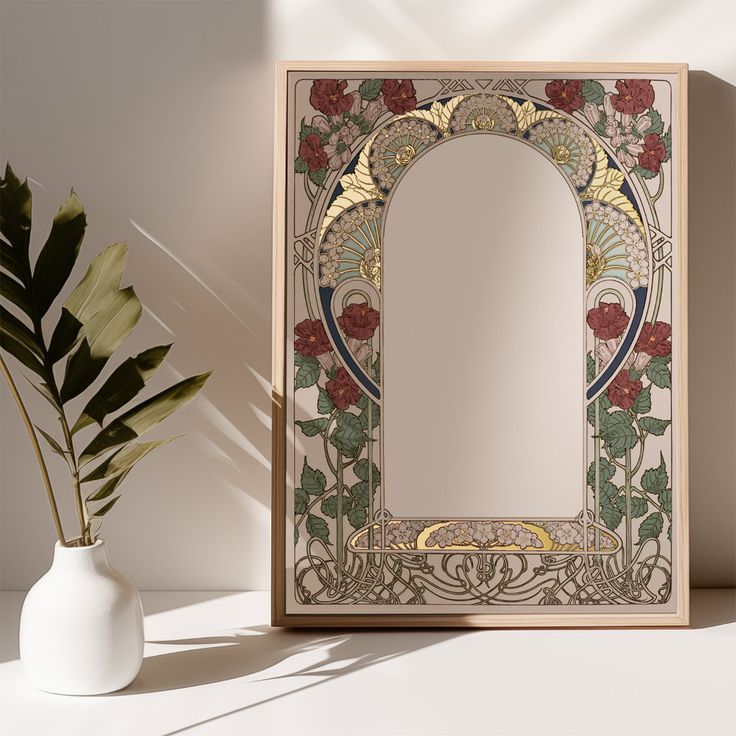 a mirror sitting on top of a table next to a potted plant