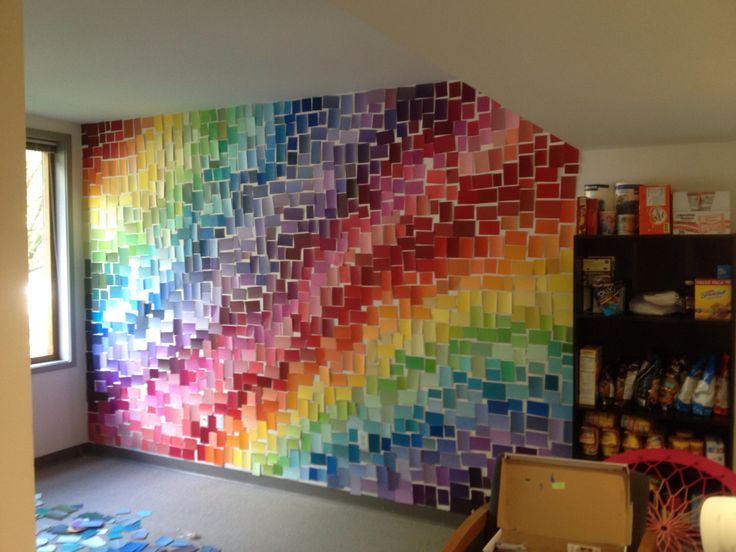 a room that has a large colorful wall in it