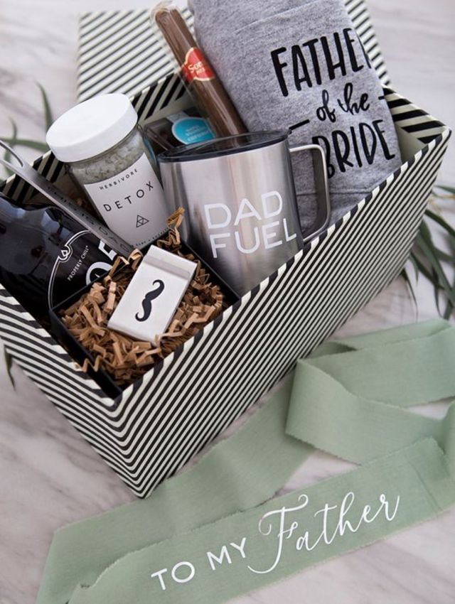 a father's day gift box filled with personalized items and coffee mugs