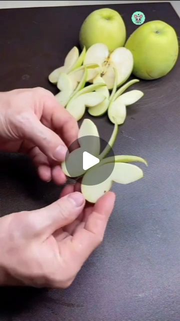 someone is cutting up some apples on a table