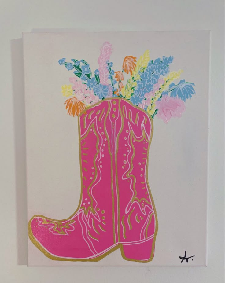 a pink cowboy boot with flowers in it on a white wall next to a star