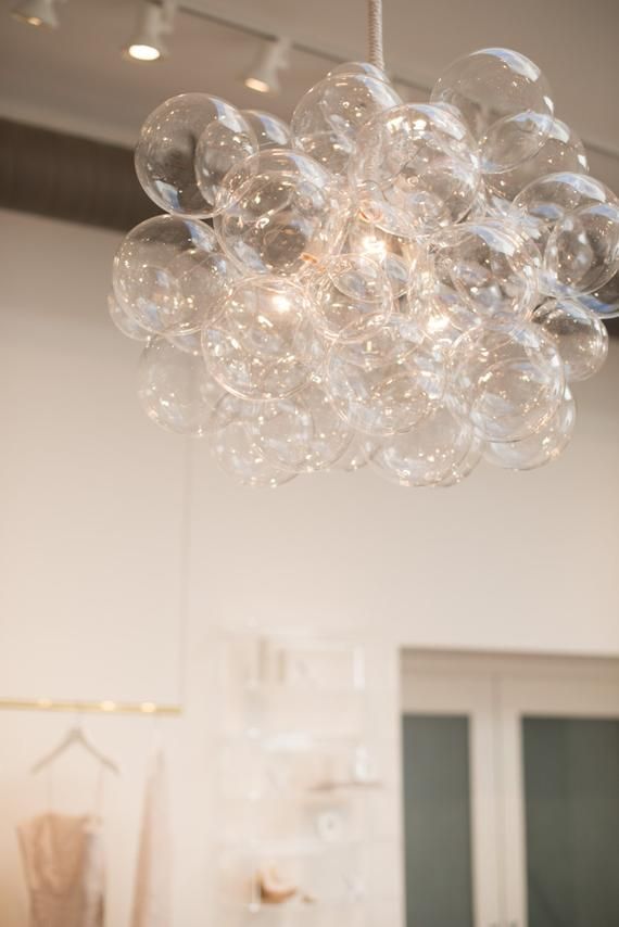 a chandelier hanging from the ceiling in a room