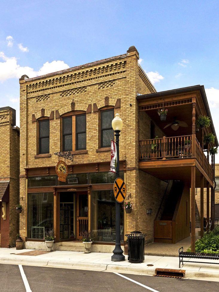 an old brick building on the corner of a street