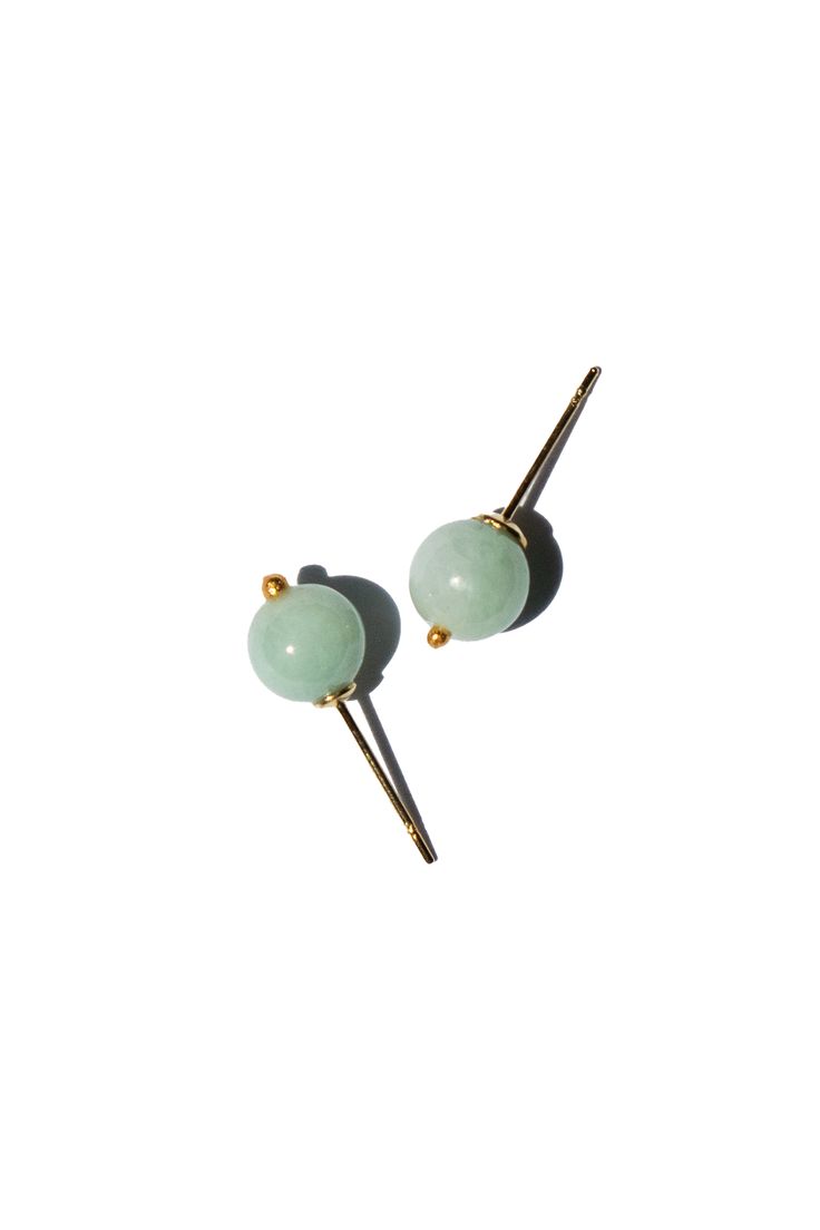 These delicate Mira jadeite sphere studs bring a subtle elegance to any outfit with their minimalist and refined design. The smooth jadeite beads shine with natural beauty, making them a perfect accessory for both casual and formal looks. Avoid knocking against hard surfaces. Jade pieces are brittle and will break when hit with hard objects. Make sure that you take off your jewelry before you go swimming in a pool or hot tub. If you’re handing dirt and soil, quartz dust in soil is abrasive to th Go Swimming, September Birthstone Jewelry, August Birthstone Jewelry, July Birthstone Jewelry, Subtle Elegance, Zodiac Jewelry, Jewelry Ring Box, Pearl Jewellery Earrings, Jade Jewelry