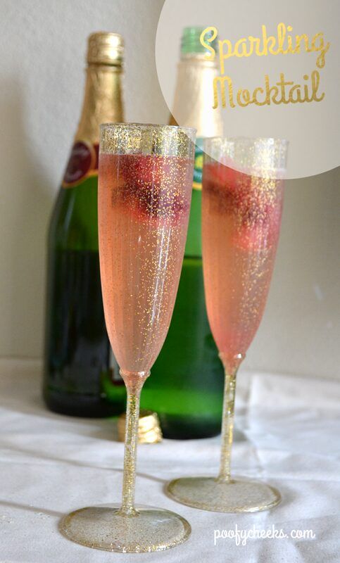 two champagne flutes sitting on top of a table