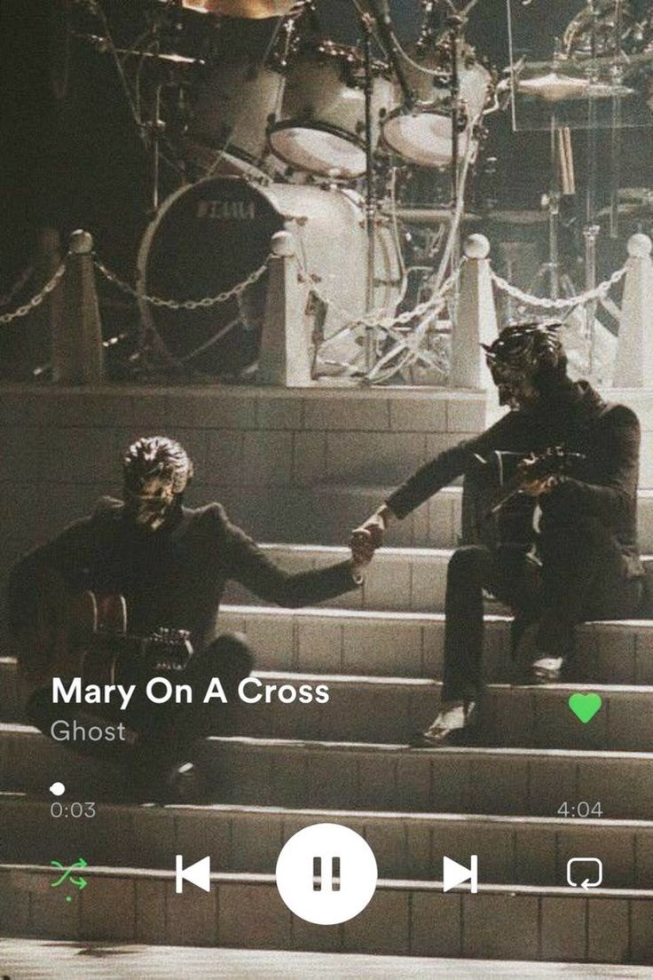 two people sitting on steps holding hands with the words mary on a cross above them