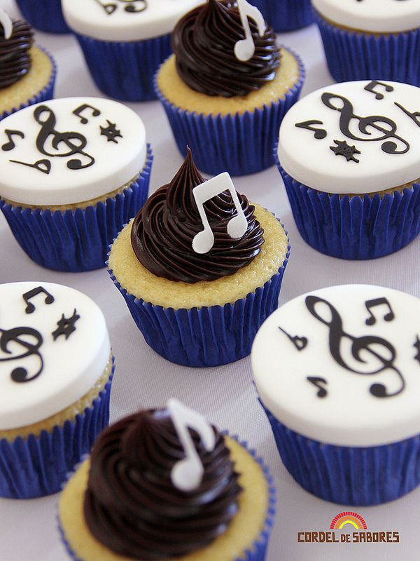 cupcakes decorated with music notes and chocolate frosting