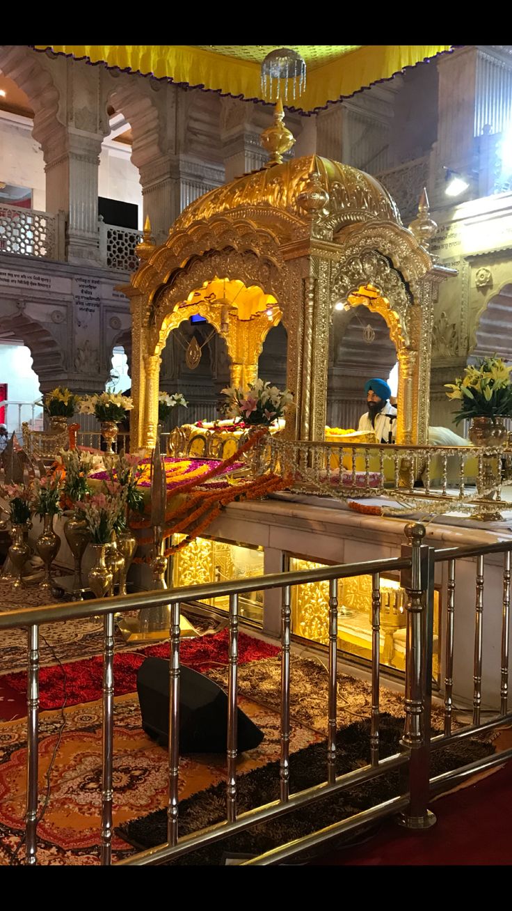 an elaborately decorated room with gold and red accents