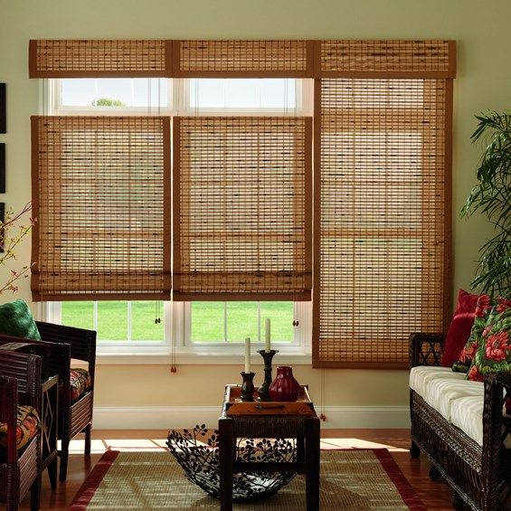 the living room is decorated with bamboo blinds