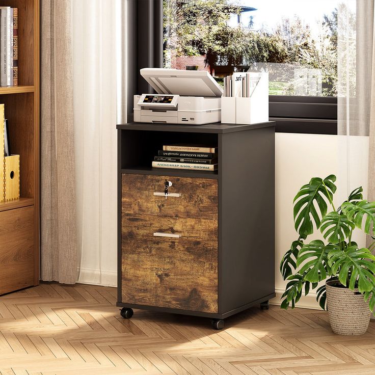 a small wooden cabinet with drawers in front of a window and a potted plant next to it