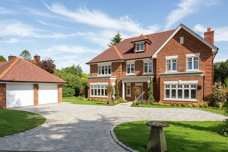 a large brick house with lots of windows