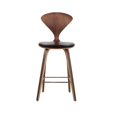 a wooden bar stool with black leather seat and backrests on an isolated white background