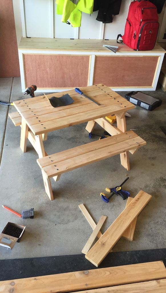 several pieces of wood sitting on the floor in front of some workbench tools