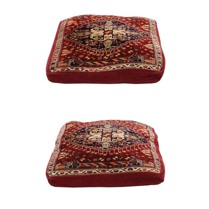 two red rugs sitting on top of each other