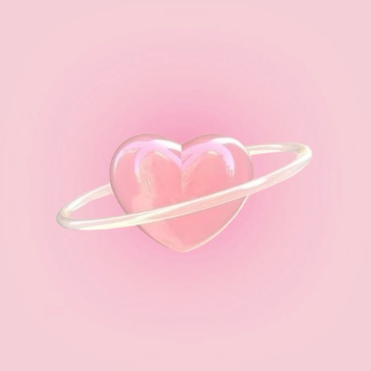 a pink heart in the center of a white ring on a pink background with space around it