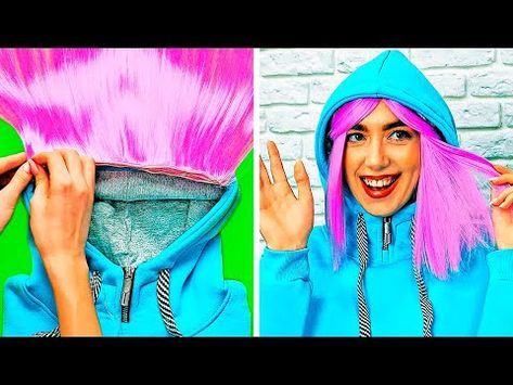 a woman with pink hair and blue hoodie