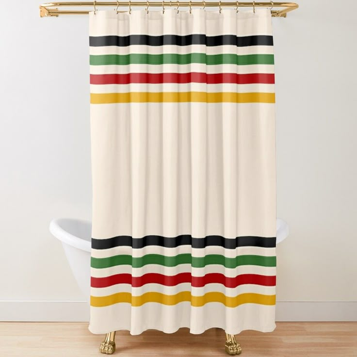 a shower curtain with multicolored stripes on the bottom and bottom, hanging in a bathroom