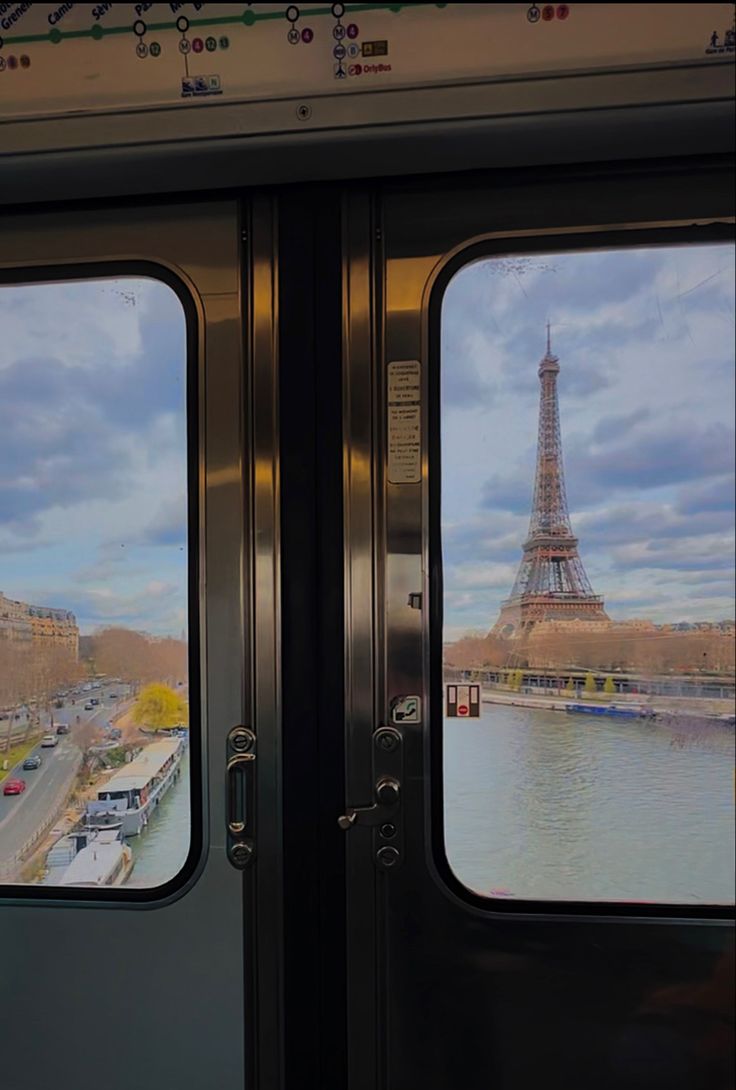 two doors open to look out at the eiffel tower