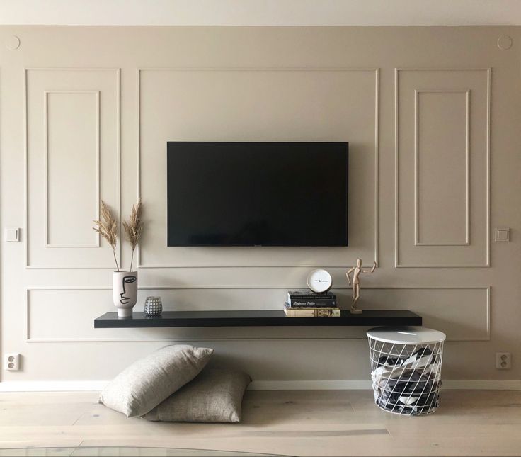 a flat screen tv mounted to the side of a wall