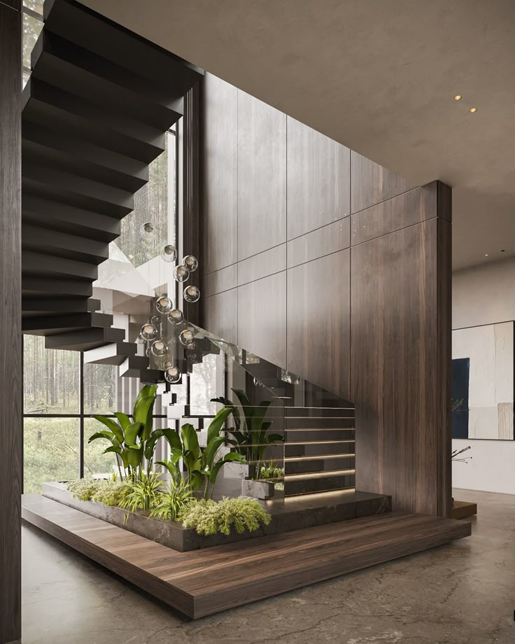 a staircase with plants in the center and stairs leading up to it's second floor