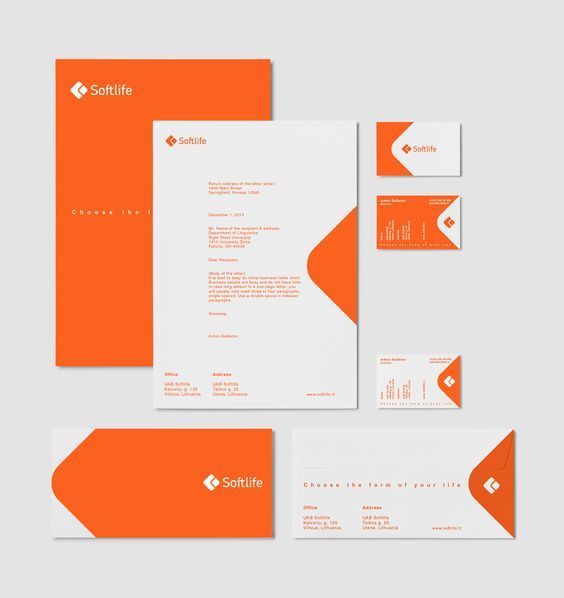 an orange and white stationery set with business cards, envelopes, and letterhead