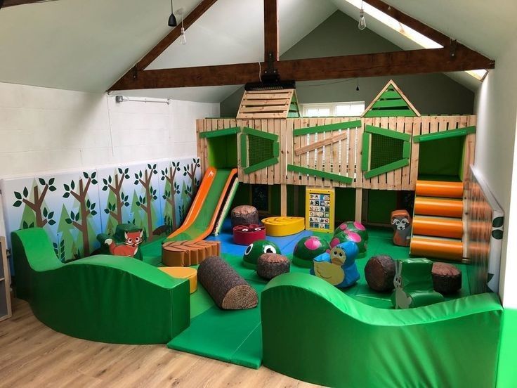 children's play area with slide and climbing wall