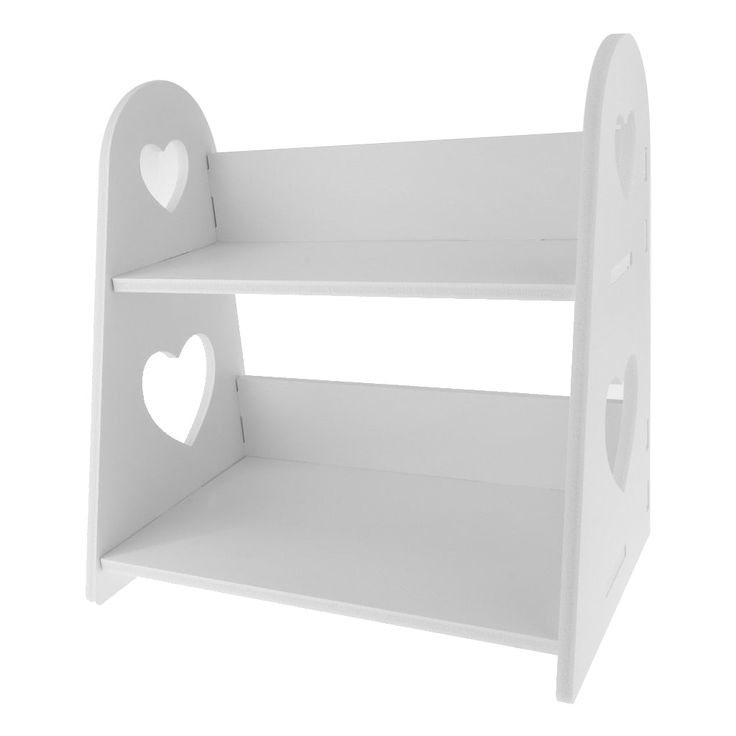 a white shelf with two hearts cut out of the top and one on the bottom