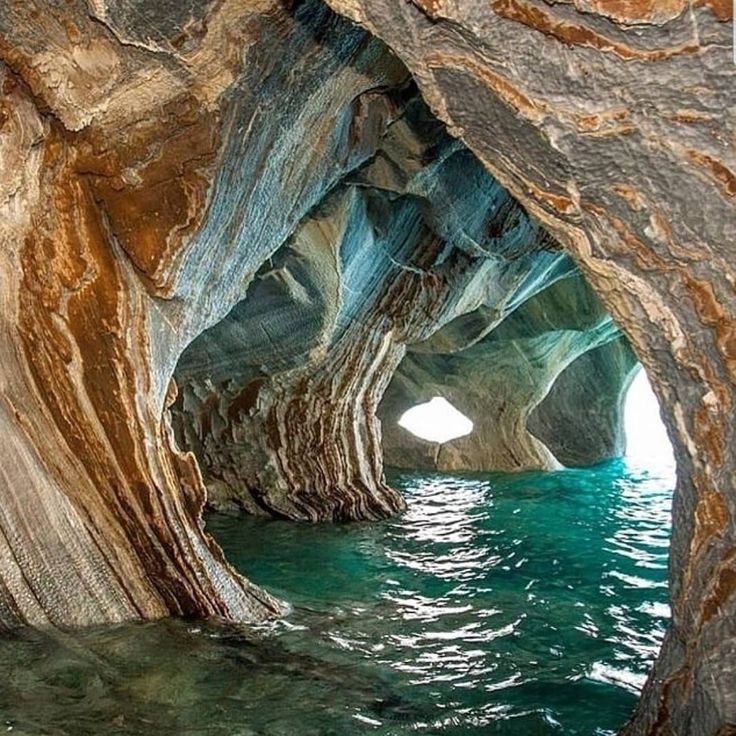 the inside of a cave with water in it