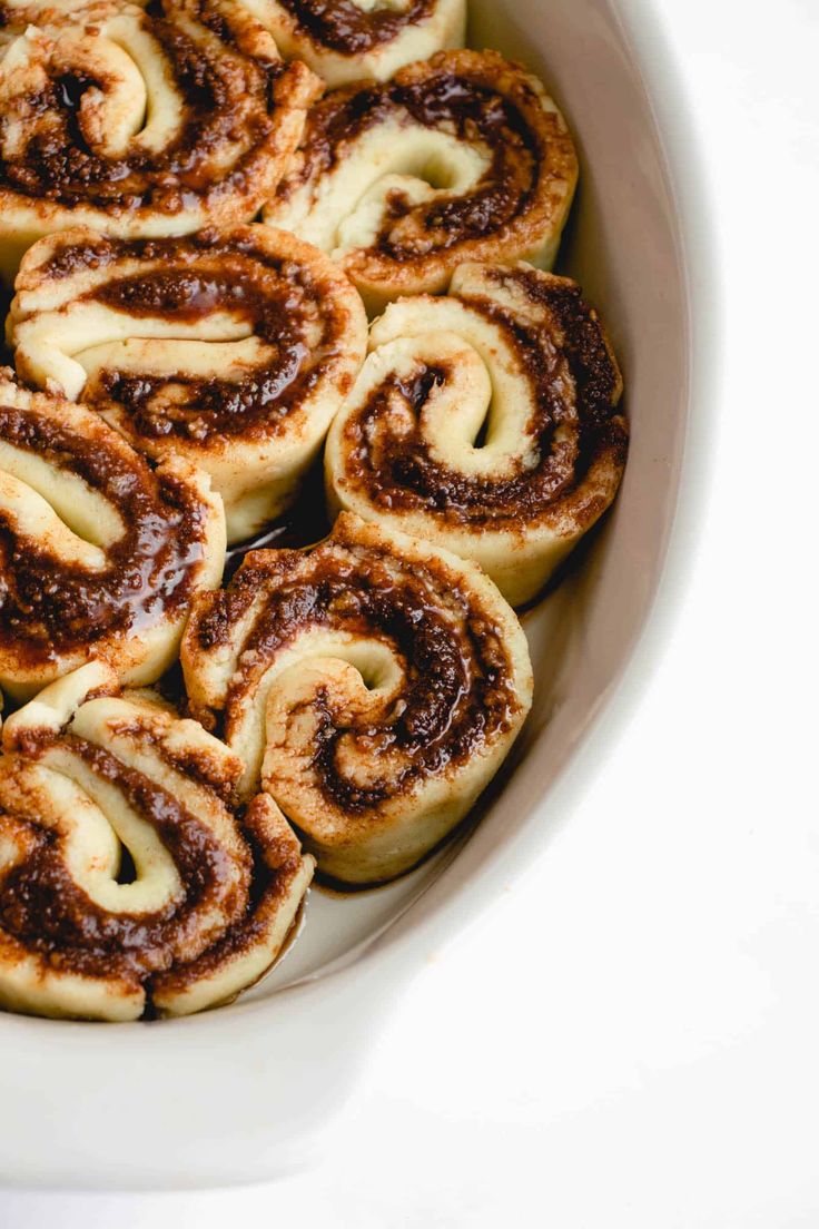 cinnamon rolls in a white bowl with text overlay that reads, heal me delicious grain free cinnamon rolls