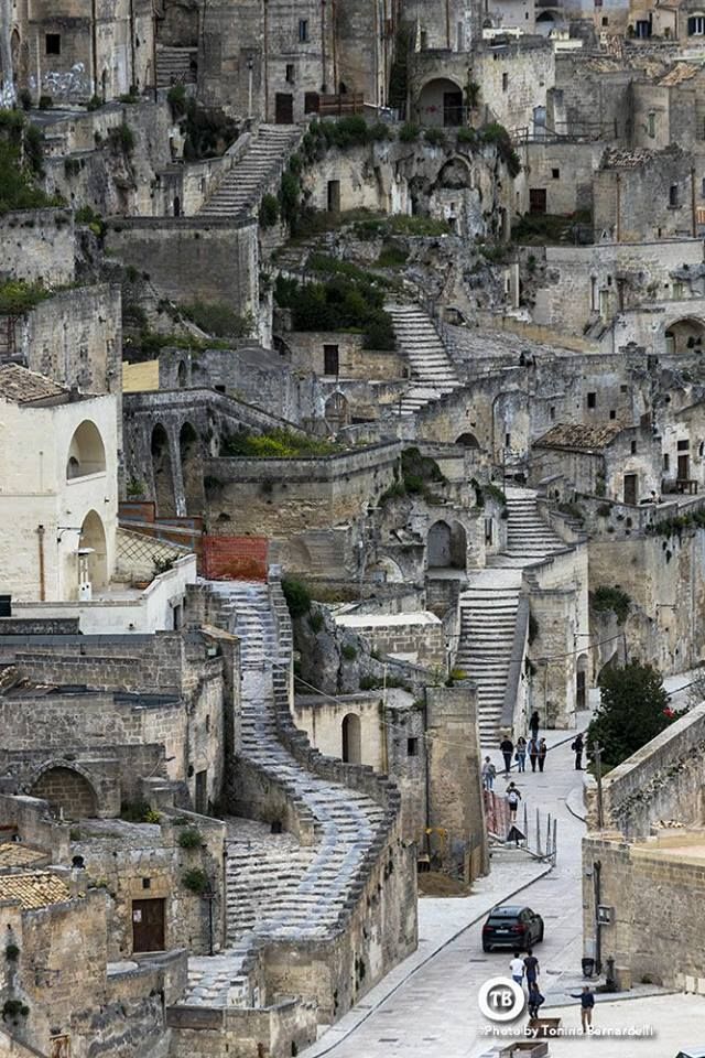 an aerial view of some old buildings with stairs leading up to the top and down