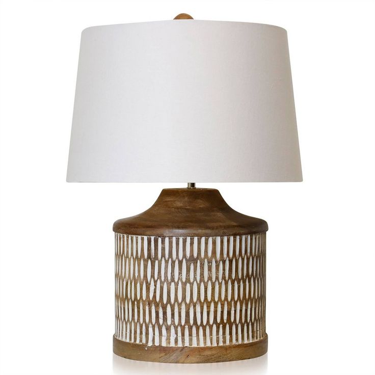 a table lamp with a white shade on it's base and an oval design