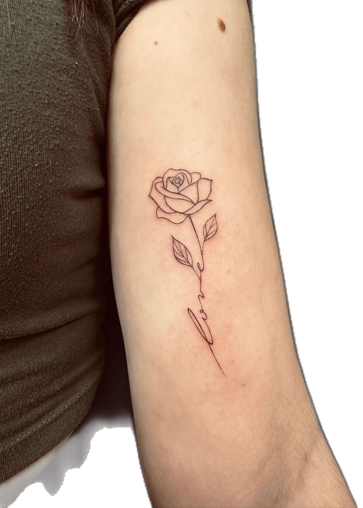 a woman's arm with a rose tattoo on the left side of her arm