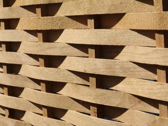 a wooden fence that is made out of wood planks