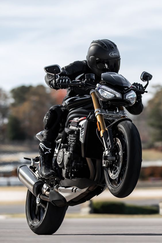 a man riding on the back of a motorcycle