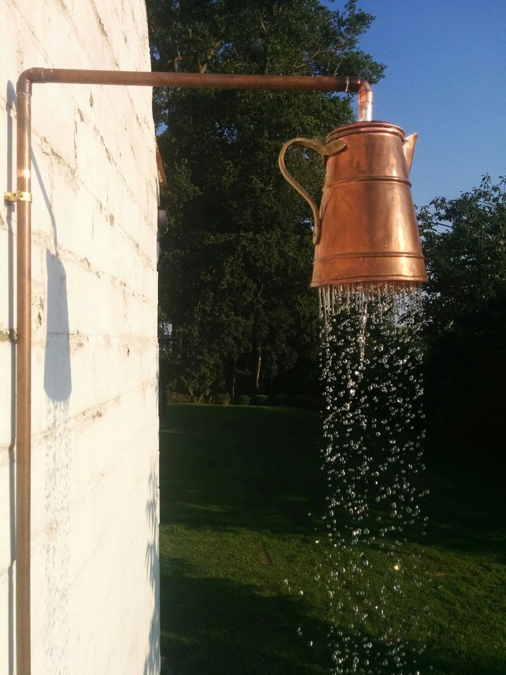 a watering can that is pouring water out of it