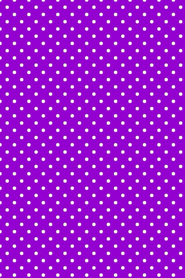 a purple background with white polka dots