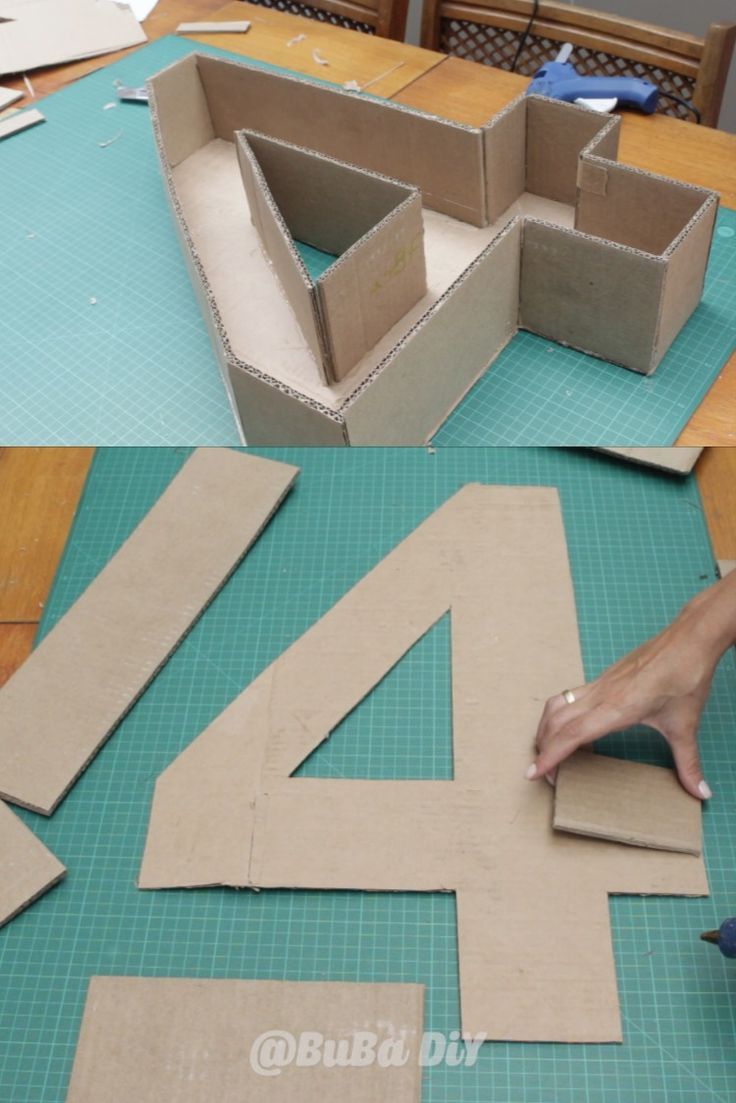 someone is making a cardboard house out of cardboard and then cutting it into smaller pieces