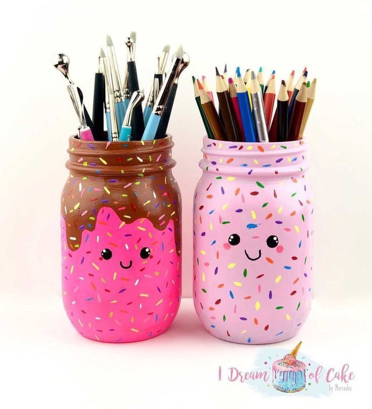 two jars with pens and pencils in them