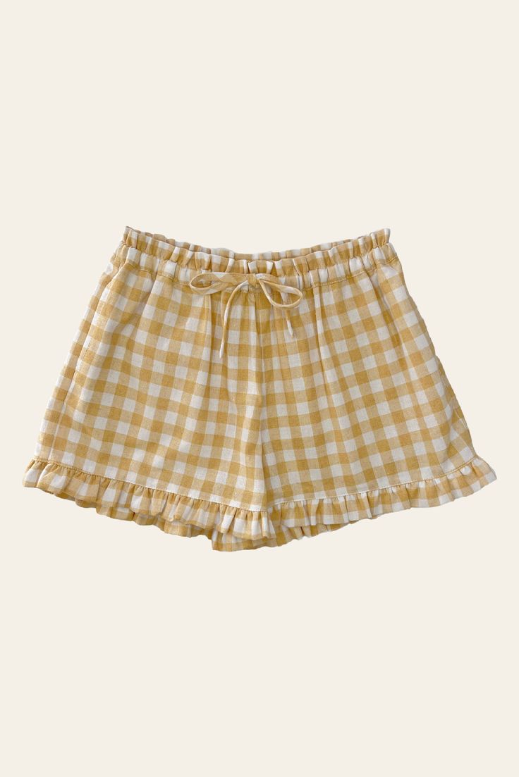 Playful and fun, the Penny Shorts are the perfect summer staple that your little one will love. Crafted in our beautiful buttercup check linen, featuring an easy, relaxed fit with pull on elastic waist and self tie for a perfect fit. Beautifully finished with flat ruffles that trim the waistband edge and hemline, and little side pockets, perfect for keeping trinkets and treasure found throughout the day. Pair with the Dune Blouse for the sweetest matching set.30% Linen / 70% Cotton.Due to the na Matching Set Pattern, Cute Kawaii Outfits, Ruffled Shorts, Shorts Sewing, Diy Clothes Design, Fashion Tops Blouse, Sewing Projects For Kids, Easy Trendy Outfits, Ruffle Shorts