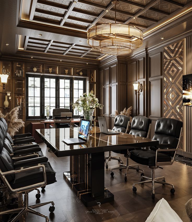 a large conference room with black leather chairs and wooden paneled walls, along with a chandelier