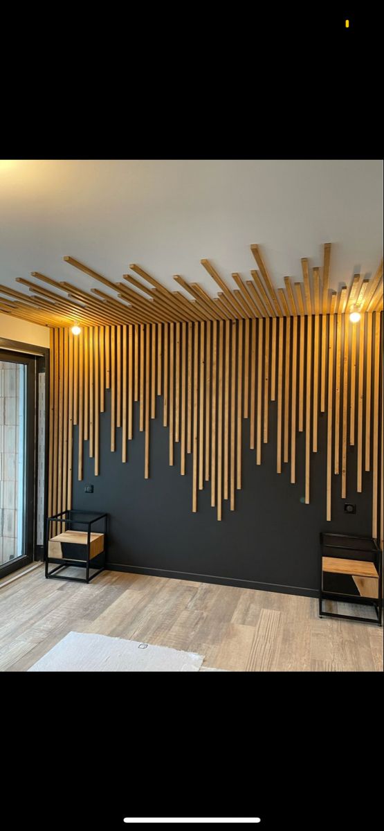 an empty room with wood slats on the wall