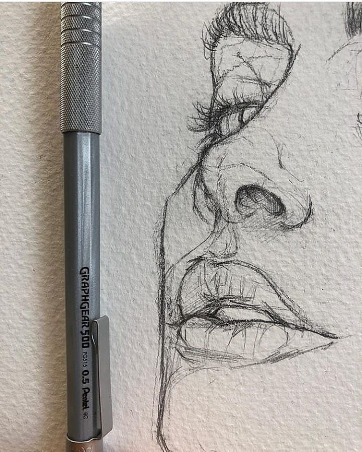 a pencil drawing of a man's face with his eyes closed and nose open