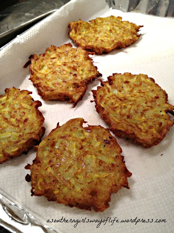 four fried food items sitting in a pan