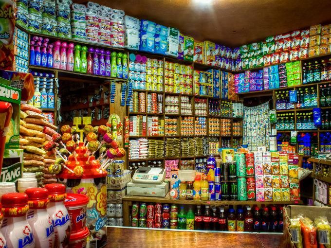 a store filled with lots of different types of drinks and condiments on display