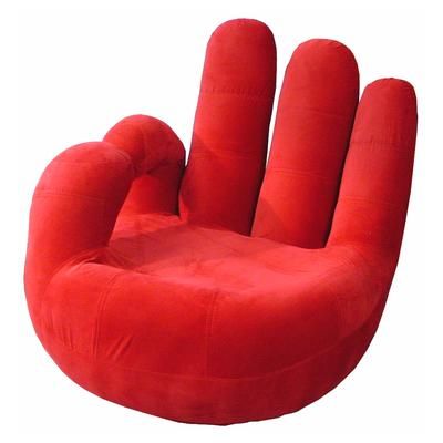 a large red hand shaped chair sitting on top of a white floor