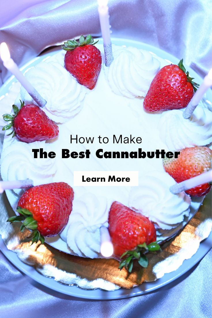 a white cake with strawberries on top and candles in the middle that says how to make the best cannabutter learn more