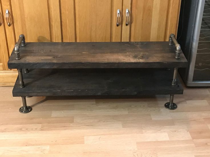 a wooden table with metal legs in a kitchen