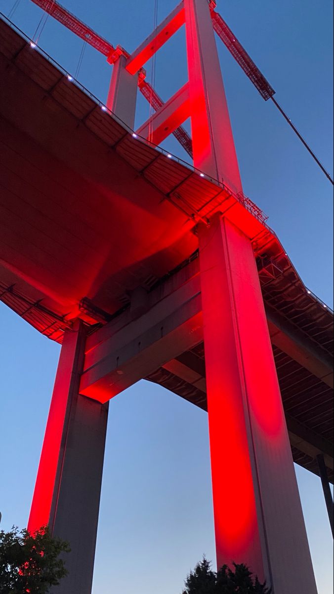 the red light is shining on the bridge