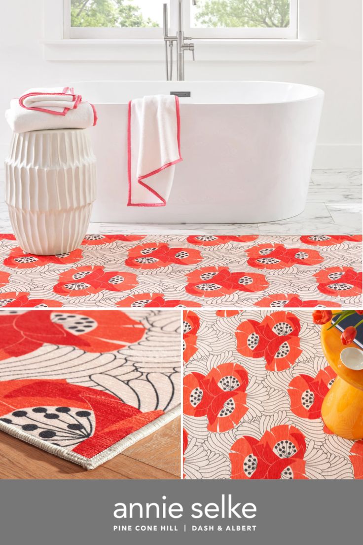 an orange and white bathroom with red flowers on the floor, bathtub and rug