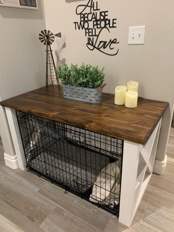 a dog crate with some candles on top of it